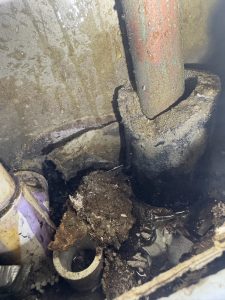 A copper pipe and a PVC pipe in a wet wall.